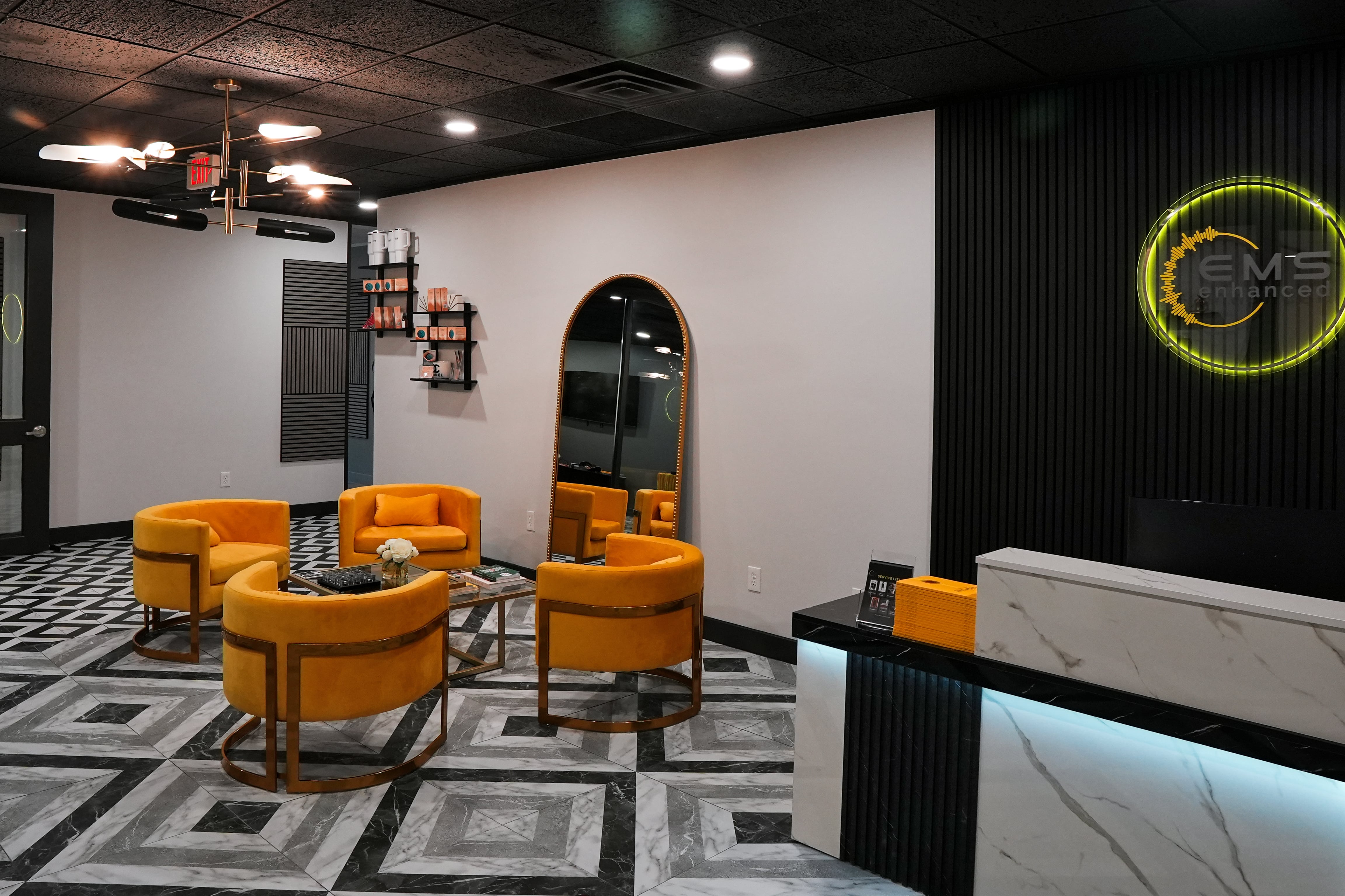 A woman wearing a full-body EMS training suit during a workout.